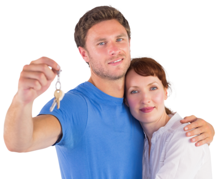 Couple holding keys to home