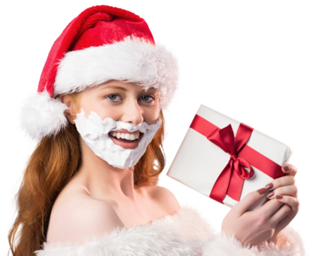 Festive redhead in foam beard holding gift