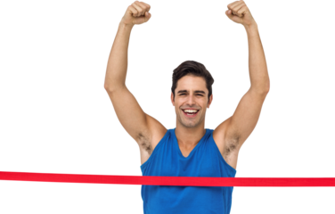 Portrait of cheerful winner athlete crossing finish line