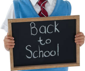 Schoolboy holding slate with back to school text against white background