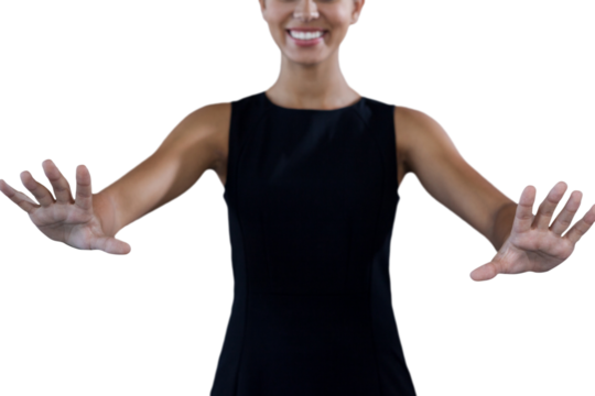 Mid section of happy young businesswoman using invisible interface