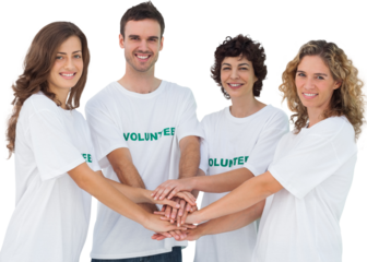Smiling volunteer group piling up their hands