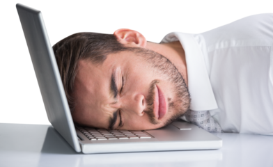 Cheerful businessman resting head on his laptop