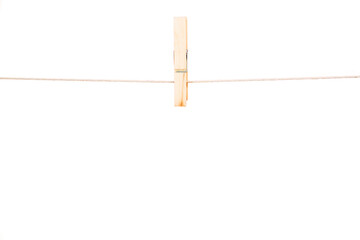 Clothespins hanging against white background