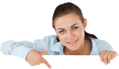 Fototapeta premium Businesswoman pointing on sign under her