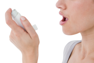 Asthmatic pretty brunette using inhaler 