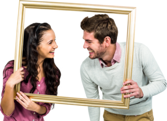 Stylish couple holding picture frame