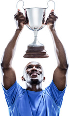 Happy sportsman looking up while holding trophy