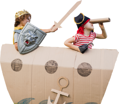 Boys in pirate costumes with artificial cardboard ship
