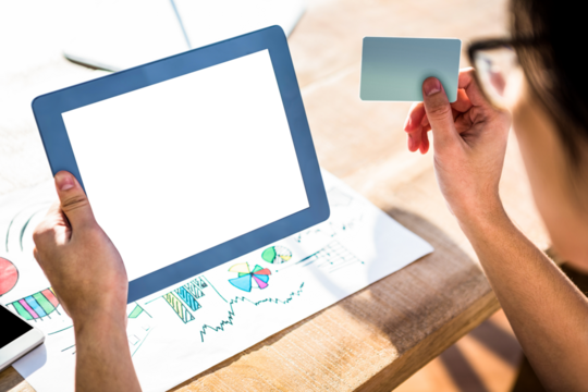 Cropped image of hipster businessman using tablet and credit card