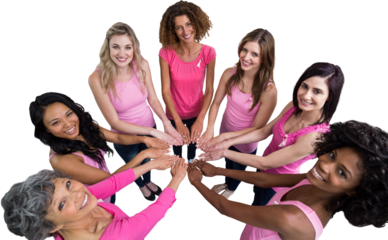 Women in pink outfits joining in a circle for breast cancer awareness