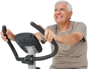 Portrait of a happy senior man on stationary bike