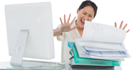 Businesswoman shouting with stack of folders at desk