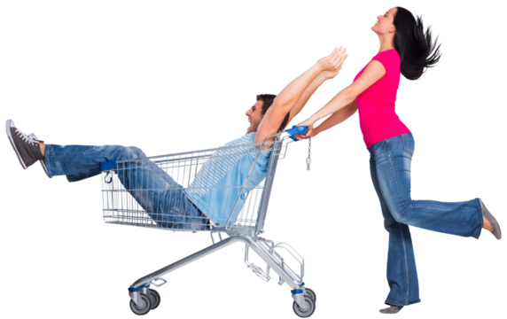 Young couple having fun with shopping cart