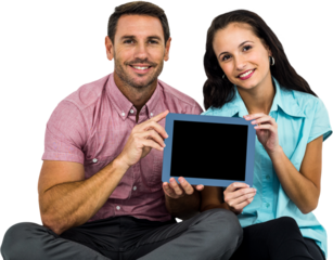 Smiling couple showing tablet at the camera