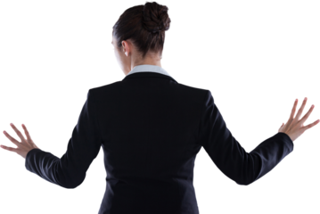 Rear view of businesswoman standing while using digital screen