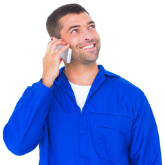 Mechanic looking up while talking on mobile phone