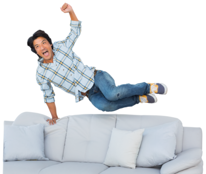 Football fan jumping over the couch