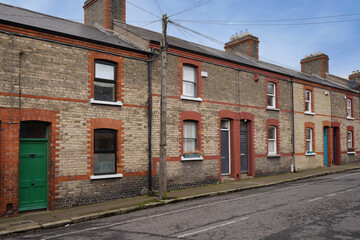 Row of small brick working class townhouses