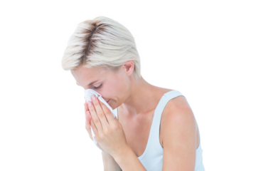 Sick woman blowing her nose