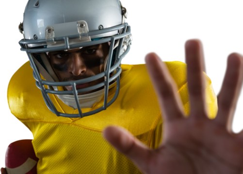 Portrait of American football player with ball gesturing