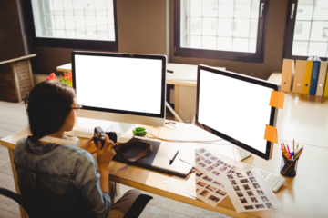 Graphic designer holding digital camera