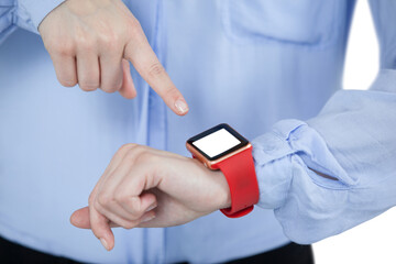 Midsection of businesswoman pointing at smart watch