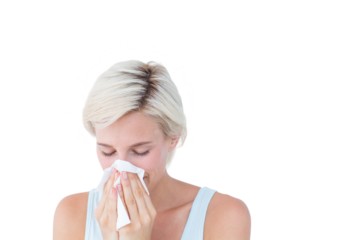 Sick woman blowing her nose