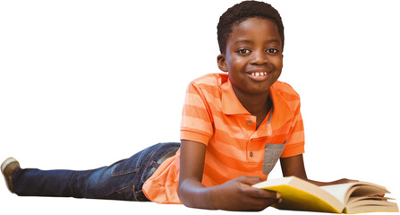 Cute boy reading book in library