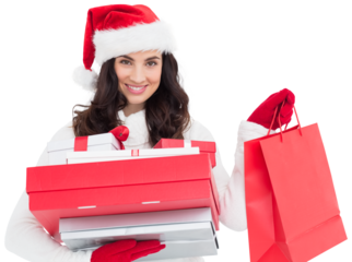 Festive brunette holding christmas gifts and shopping bags
