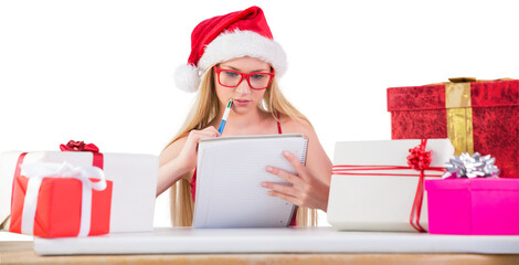 Festive blonde writing her christmas list