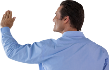 Rear view of mature businessman touching invisible interface