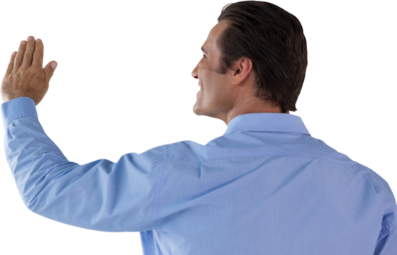 Rear view of mature businessman touching invisible interface