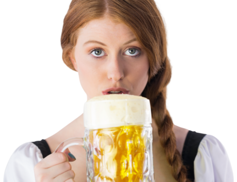 Oktoberfest girl drinking jug of beer - Powered by Adobe
