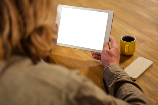 Woman holding digital tablet in cafe