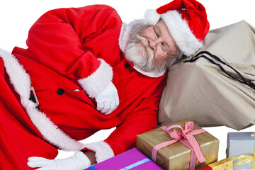 Santa Claus sleeping beside Christmas presents