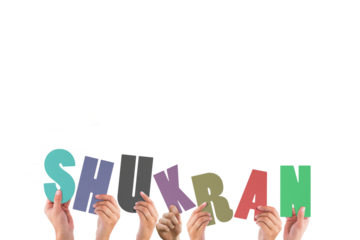 Colorful alphabet spelling thank you in Arabic held up by people