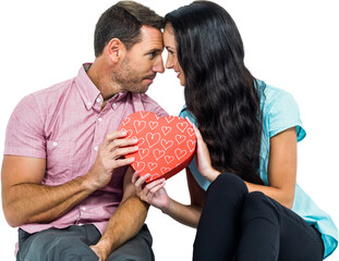 Peaceful couple holding a heart shaped box