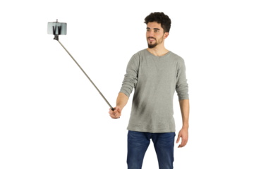 Casual man using a selfie stick