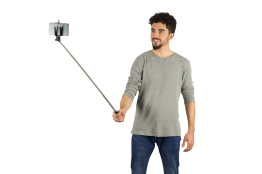 Casual man using a selfie stick