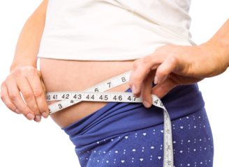 Pregnant woman measuring her bump