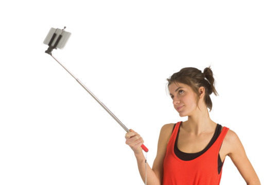 Casual brunette using selfie stick