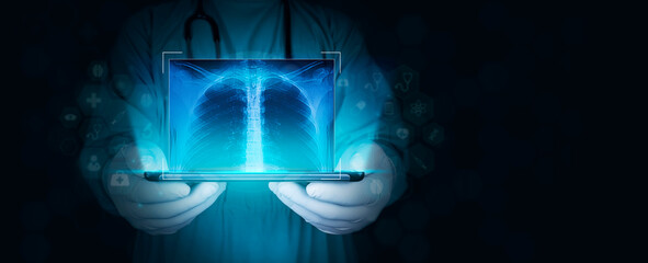 professional radiologist with tablet examines a radiograph for X-ray medical diagnosis. Doctor with...