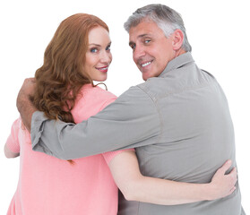 Casual couple standing arms around