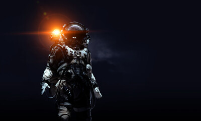 Astronaut in suit against black background. Space technology concept