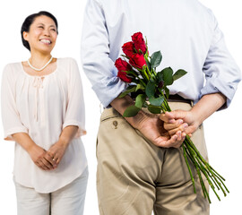 Fototapeta premium Man standing with roses by woman