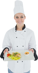 Portrait of happy female chef holding plate with food