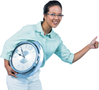 Delighted businesswoman holding a clock