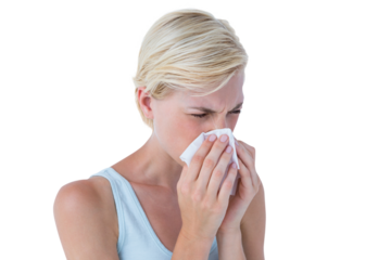 Portrait of woman blowing her nose