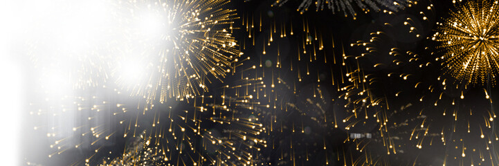 Gold colored fireworks exploading at night